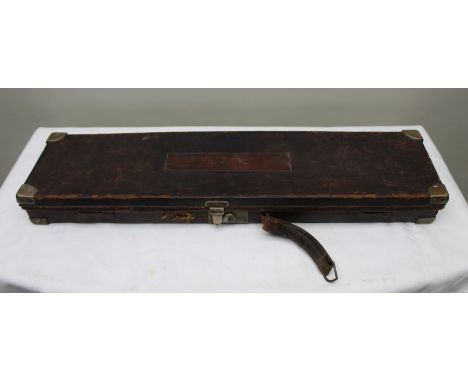 An early 20th century 'Linsley Brothers' leather single gun case, monogrammed 'R.J.L.', beize lined interiors, 81cm wide, con