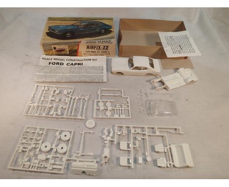 Airfix 1/32 scale Ford Capri kit, appears complete, bonnet and front skirt glued to bodyshell, and one wheel hub/tyre joined,