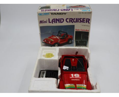 Boxed 1980s 1/16 scale Tandy radio controlled Mini Land Cruiser. UK P&amp;P Group 2 (£20+VAT for the first lot and £4+VAT for