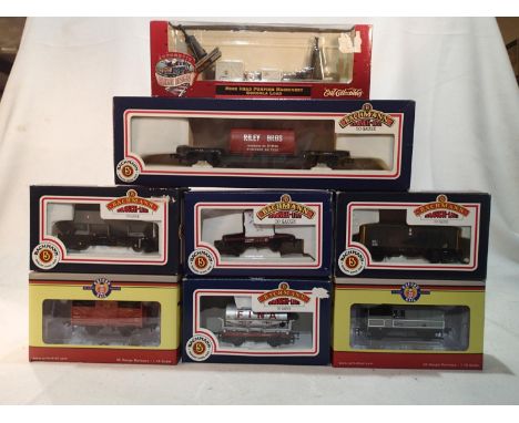 Seven assorted OO scale wagons, Oxford Rail and Bachmann, mostly excellent condition, plus HO scale mine head pumping machine