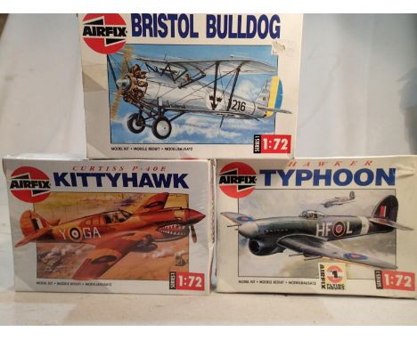 Three Airfix aircraft kits, 1/72 scale, Bristol Bulldog, p.40E Kittyhawk, and Typhoon, sealed, wear to boxes. UK P&amp;P Grou