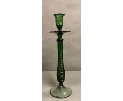 A vintage emerald green hand blown glass candle stick 