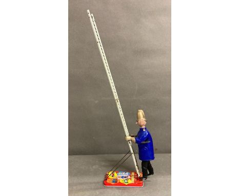 A Gordon Murray puppets Ltd clockwork tin Trumpton Town Fire Brigade ladder climbing fireman made by Marx.