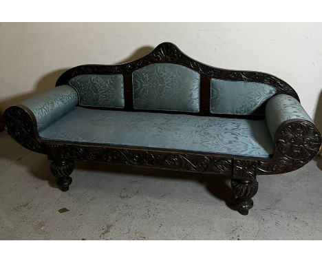 An ebonised Anglo Indian sofa 