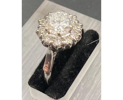 A vintage diamond daisy or cluster ring in a platinum setting, main diamond approx 1.95ct J/K colour SI2 clarity. Total diamo