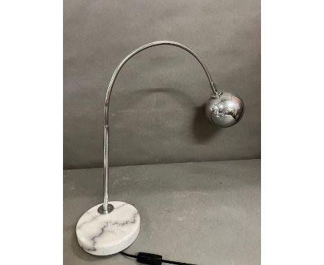 A contemporary chrome arc lamp 