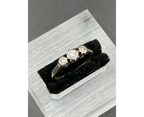 A Three stone diamond ring in 9ct yellow gold and platinum setting Size O