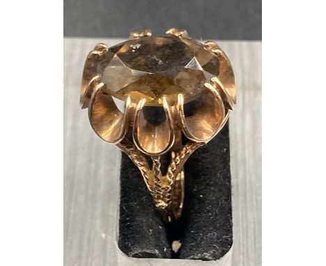 A 9ct gold ring with central smokey quartz style stone (Approximate Total weight 4.7g)