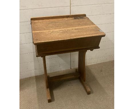 A vintage light oak school desk