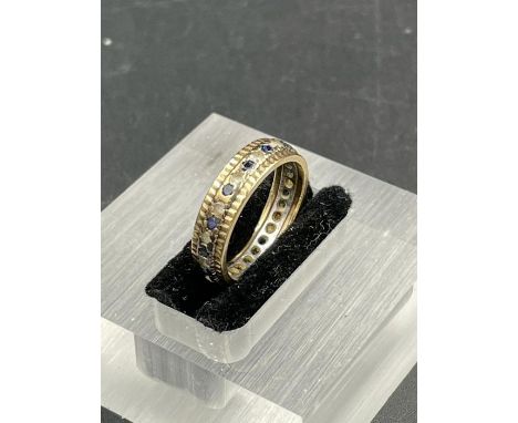 A 9ct gold ring with diamond and sapphires (Approximate Total Weight 2.5g) Size K