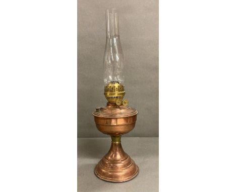 A vintage copper and brass oil lamp 