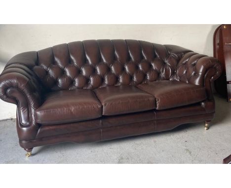 A Thomas Lloyd Regency three seater sofa and two high back chairs in oxford colour (W214cm H85cm D96cm)