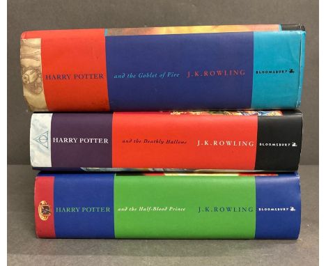 A set of three First edition hardback Harry Potter books, The Goblet of Fire, The Half Blood Prince and The Deathly Hallows 