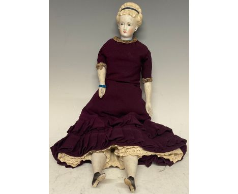 A Parian type German shoulder doll, moulded head and hair, finely painted features, blue eyes, blond hair, cloth body with bi