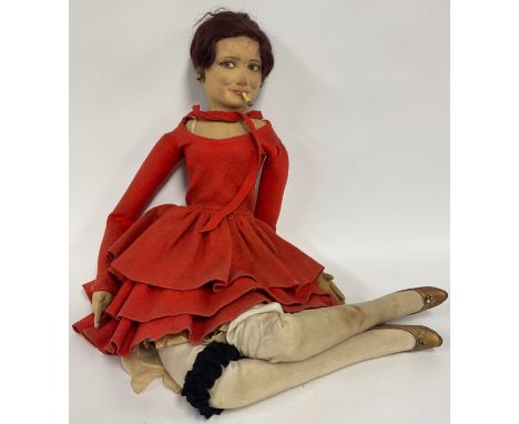 A Lenci Boudoir Doll, as a tall slender lady smoking, with short auburn hair, earrings, red felt dress, stockings and garter 
