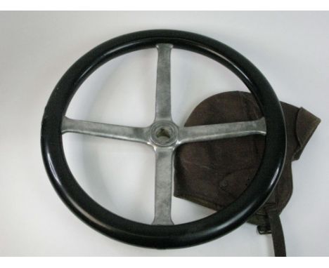 A 14-inch Veteran Car Steering Wheel having four arms, 1-inch centre and a good black celluloid grip. Also, a brown leather f