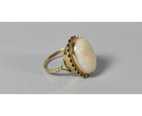 A 9ct Gold and Opal Ring with Cabochon Cut Stone, 1.9x1.4cm, London Hallmark, Size U 1/2, 5.4g 