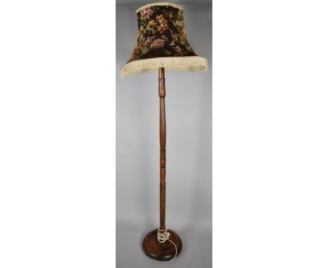 An Edwardian Oak Standard Lamp with Turned Support and Circular Base 
