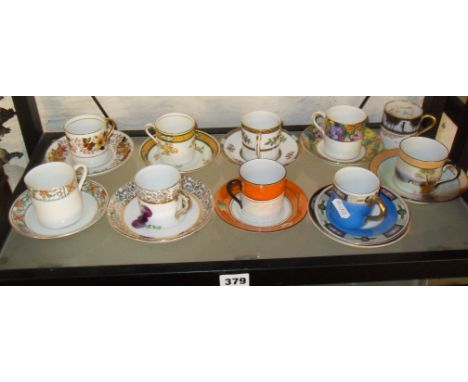Ten different pairs of china coffee cans and saucers