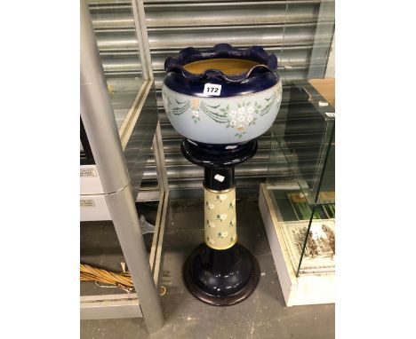 A LANGLEY STONE WARE PLANTER ON STAND DECORATED IN TWO TONES OF BLUE