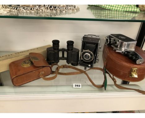 A BOLEX CINE CAMERA A FOLDING CAMERA AND A PAIR OF BINOCULARS ETC