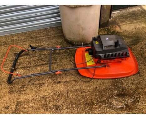 A PETROL ENGINE FLYMO LAWN MOWER