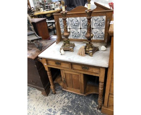 AN EDWARDIAN ASH WASH STAND WITH TILE BACK. 