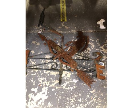 AN IRON OLD FATHER TIME WIND VANE TOGETHER WITH ARROWS TO THE POINTS OF THE COMPASS