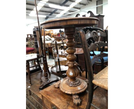 A MAHOGANY LAMP TABLE WITH CARVED FEET 