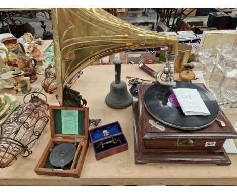 AN HMV WIND UP GRAMOPHONE WITH A BRASS HORN, A HAND BELL, A PAIR OF GLASS AND WIRE SHADES, AN ORMOLU WATCH HOLDER, TWO SCIENT