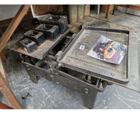 A SET OF AVERY BLACK PAINTED IRON COAL SCALES TO WEIGH TWO CWT WITH FOUR WEIGHTS