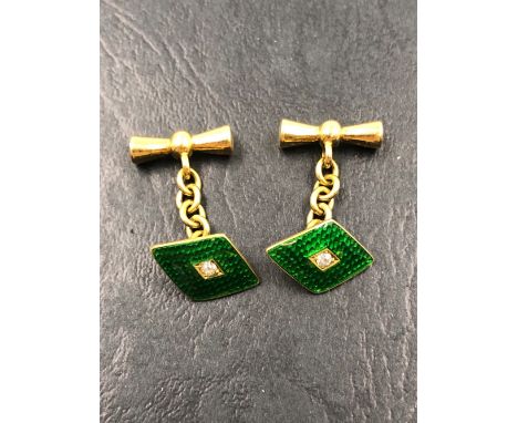 A PAIR OF ANTIQUE GREEN ENAMEL AND OLD CUT DIAMOND CUFFLINKS. EACH CUFFLINK STAMPED 18ct, T.P. GROSS WEIGHT 6.52grms. 