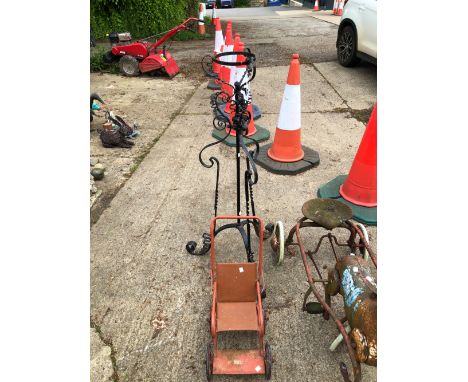 A WROUGHT IRON STANDARD LAMP AND A TRIANG DOLLS PRAM
