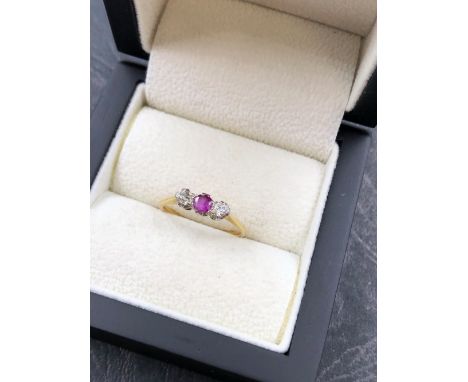 AN 18ct AND PLATINUM THREE STONE RUBY AND DIAMOND RING. THE SHANK WITH 18ct &amp; PLAT STAMPED, MARKS VERY WORN. FINGER SIZE 