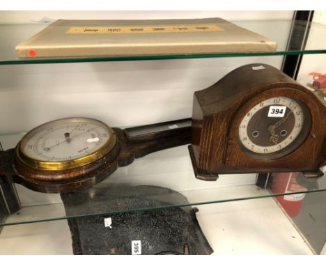 AN ANAROID BAROMETER TOGETHER WITH A MANTEL CLOCK