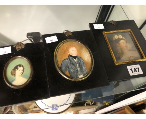THREE 19th  C. PORTRAIT MINIATURES IN BLACK FRAMES