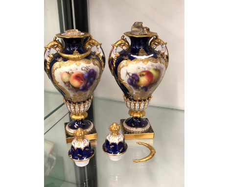A PAIR OF ROYAL WORCESTER FRUIT DECORATED GILDED URNS STAMPED 1937.