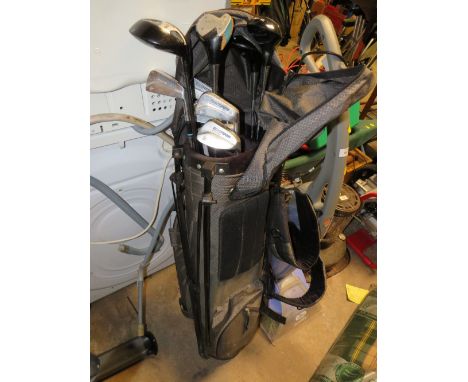 A GOLF BAG WITH VINTAGE DUNLOP IRONS