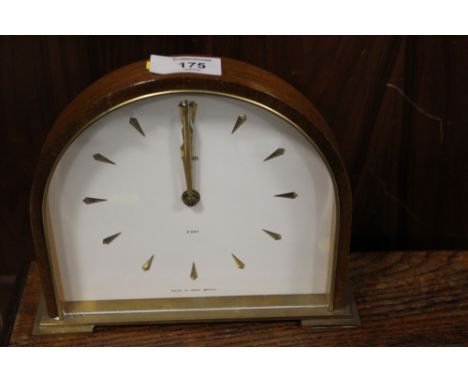 A DOME SHAPED SLIMLINE MANTLE CLOCK