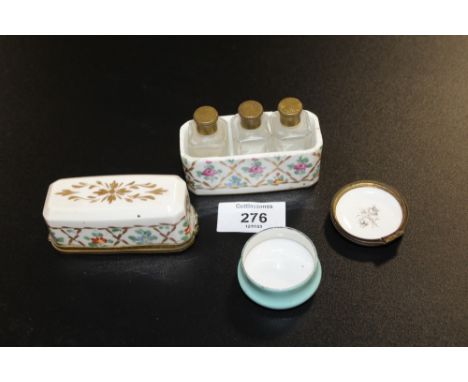 A LIMOGES CERAMIC MINIATURE THREE BOTTLE SCENT BOTTLE HOLDER - A/F TOGETHER WITH A HALCYON DAYS PILL BOX (2)
