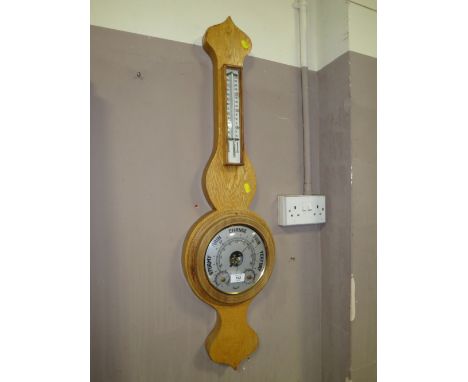 A LIGHT OAK 'DAMASTER' BAROMETER