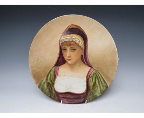 A PINDER BOURNE & Co CHARGER DEPICTING A LADY IN A HOODED ROBE, with impressed marks to the reverse and dated 1882, also mono