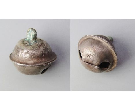 Silver Hawking Bell. Circa, 16th-17th century AD. Silver,1.49g. 13.44 x 1309 mm. A small three part bell decorated on the upp