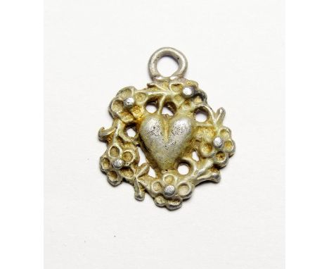 Medieval Pendant. Circa 15th century AD. Silver, 1.95g. 18.99 mm. A silver gild open-work pendant depicting a ring of flowers