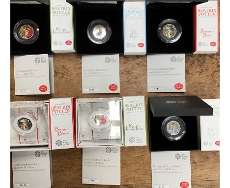 Six Royal Mint Silver Proof coloured Beatrix Potter 50p coins in Original Cases with Certificates. (two in Perspex display bl