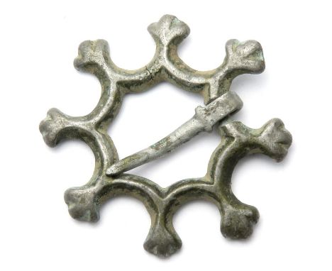 Medieval octagonal annular brooch. A medieval brooch whose frame is in the form of an octagon with concave sides and a trifol