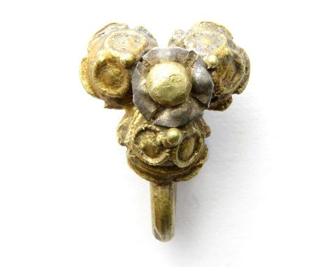 Tudor silver-gilt filigree hooked fastener. A trifoliate body with the upper surface having three conjoined hemispheres with 