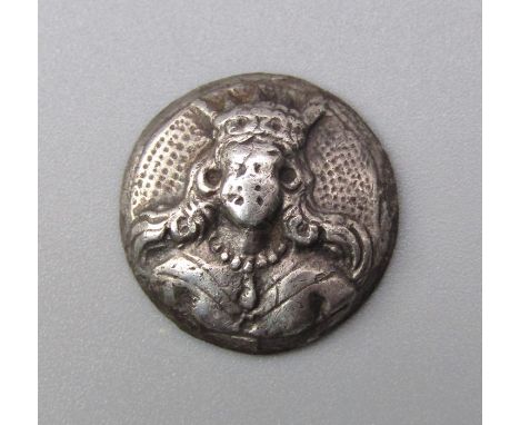 Silver Maidenhead Button. Circa 17th century. Silver, 1.49g. 14.11 mm. A two piece silver button depicting a crowned female b