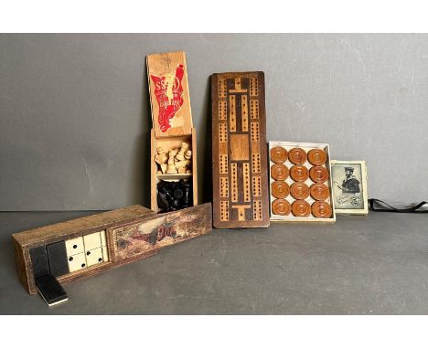 A selection of vintage games to include cribbage, draughts and dominos 