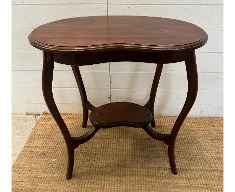 A mahogany kidney shaped side table with shelf under AF (H70cm W69cm D47cm)